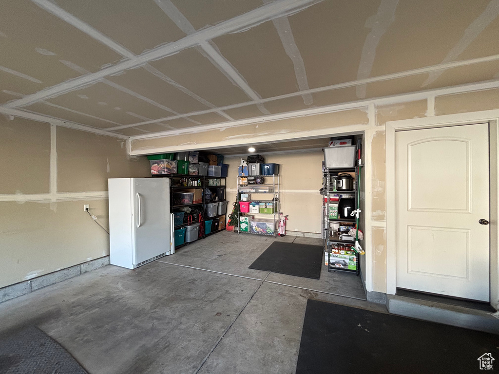 Garage with freestanding refrigerator