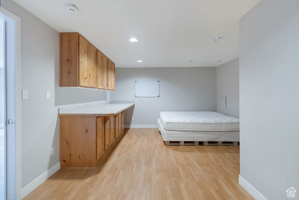 Bedroom with light wood-style flooring and recessed lighting