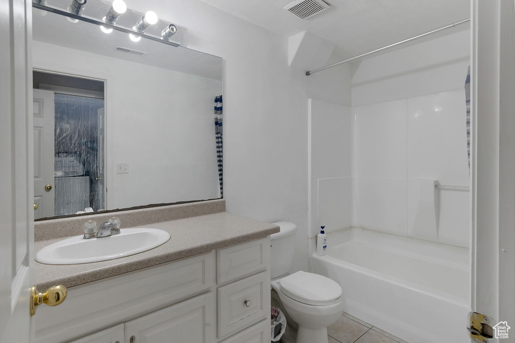 Full bathroom featuring vanity,  shower combination, and light tile patterned floors