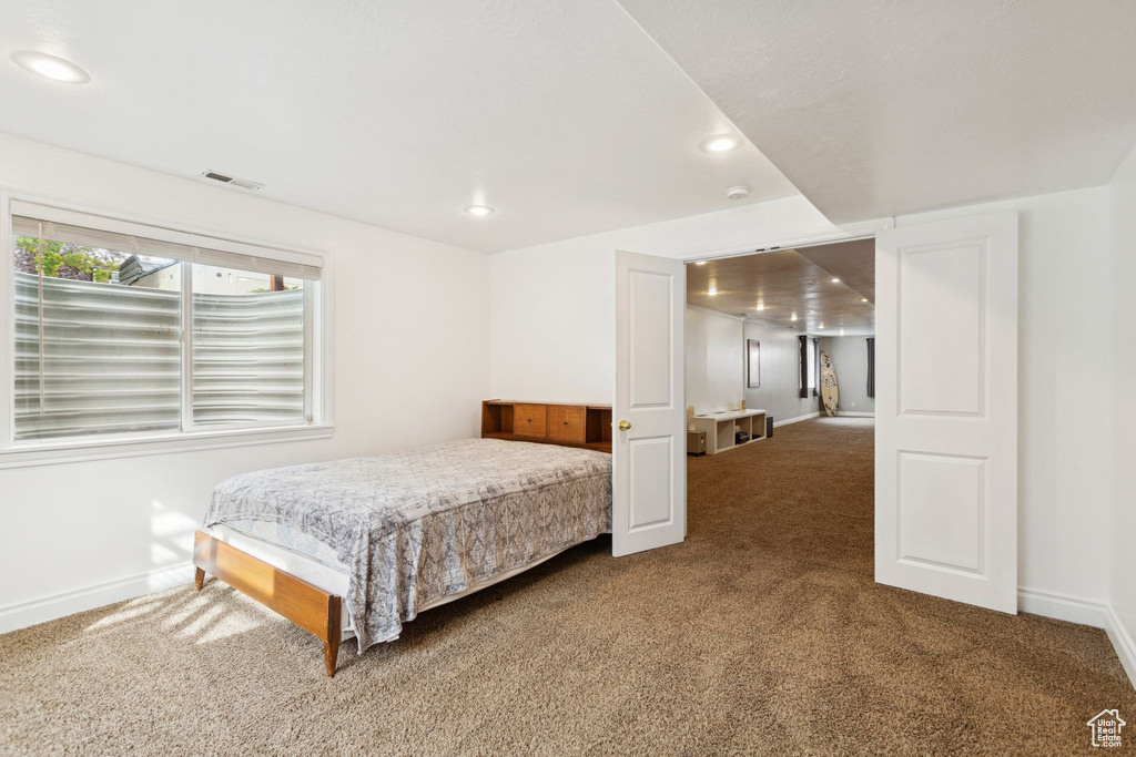 Bedroom featuring carpet flooring and recessed lighting