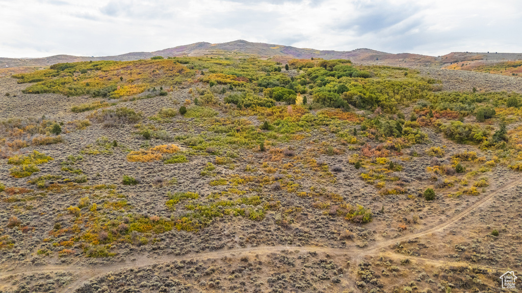 View of mountain background featuring rural landscape