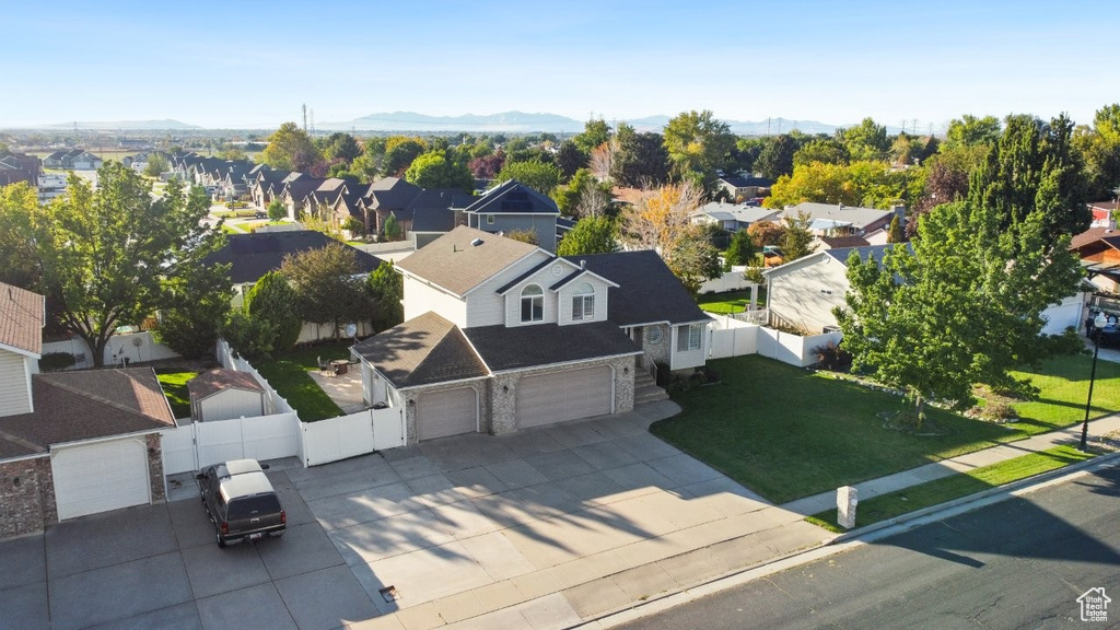 Aerial view of residential area featuring a mountain backdrop