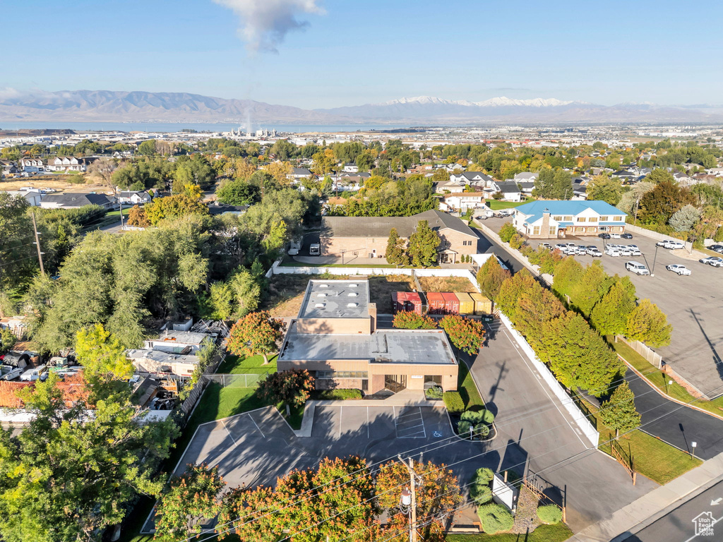 Aerial perspective of suburban area with a mountain backdrop