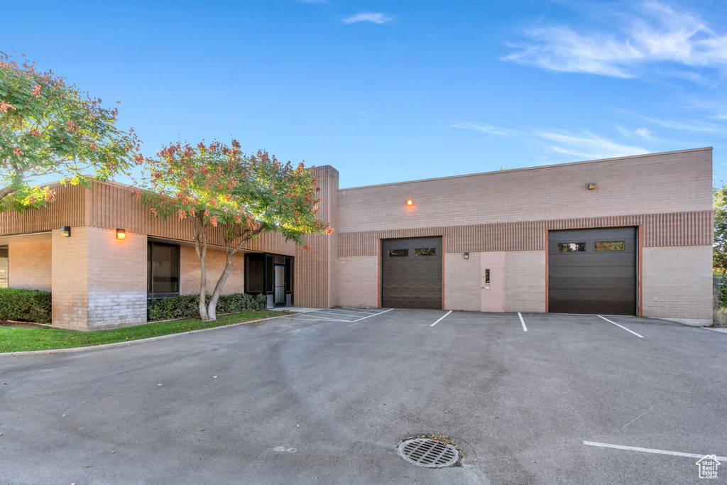 View of front facade featuring brick siding