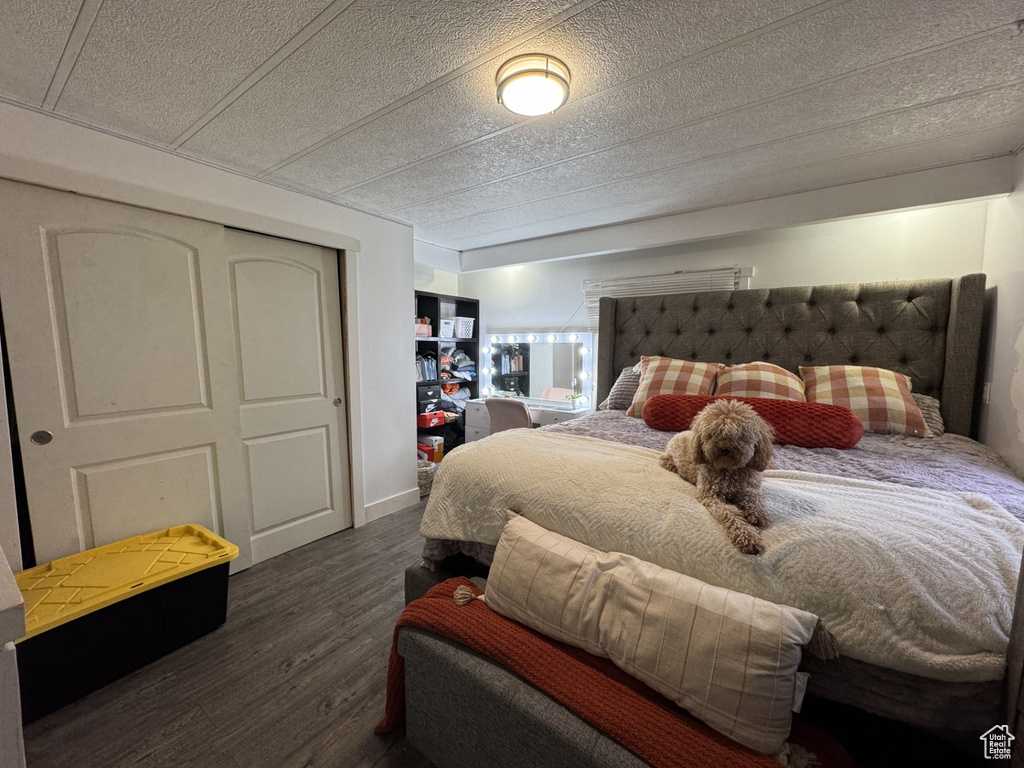 Bedroom featuring a closet and wood finished floors