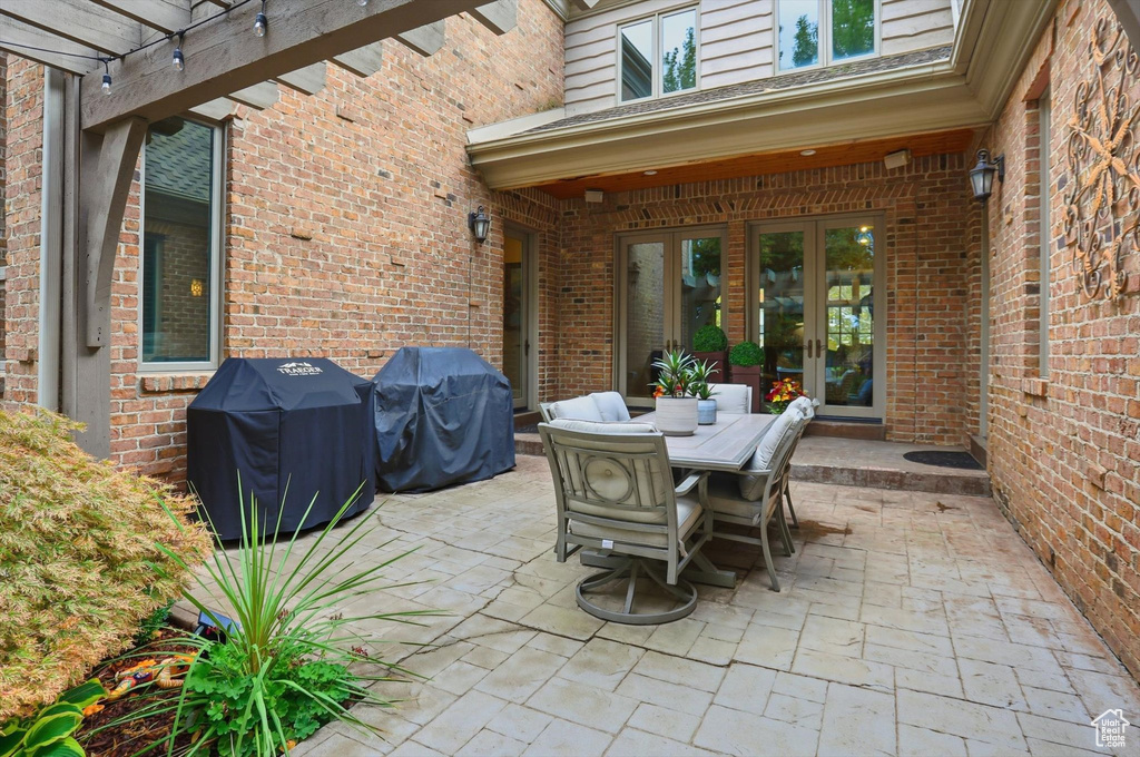 View of patio / terrace featuring a grill and outdoor dining area