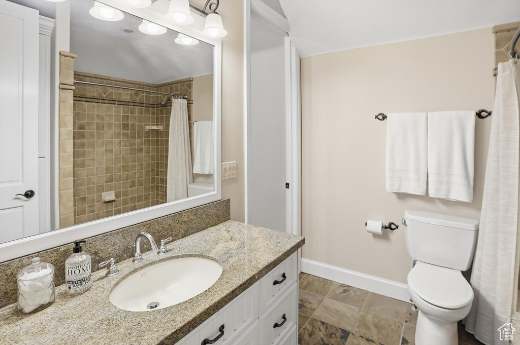 Full bath featuring vanity and a shower with shower curtain