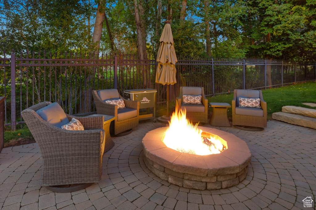 View of patio featuring an outdoor fire pit