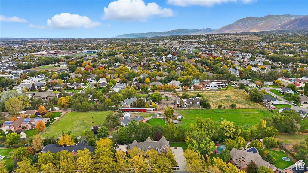 Aerial perspective of suburban area with a mountain backdrop