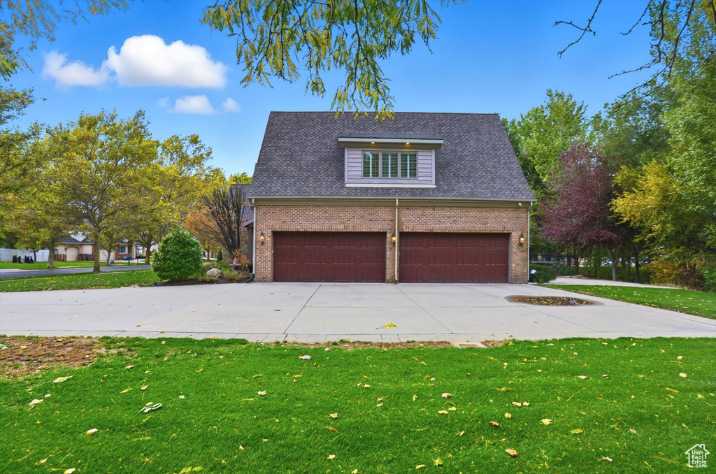 Garage featuring driveway