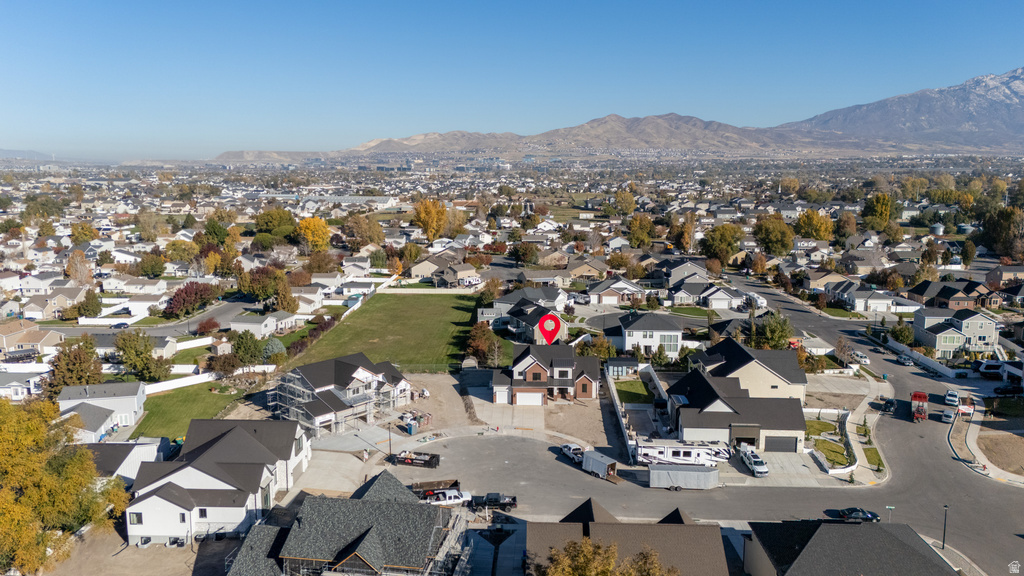 View of property location with a mountainous background and nearby suburban area