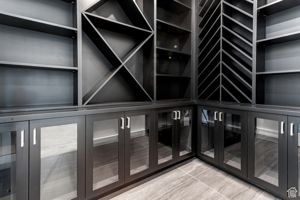 Wine room with light tile patterned floors