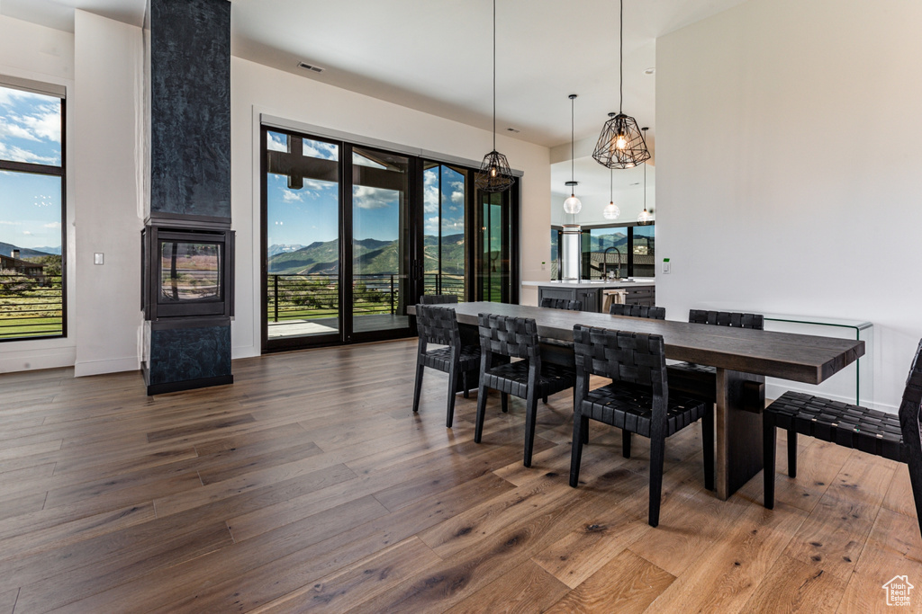 Dining space featuring a mountain view and dark wood-type flooring