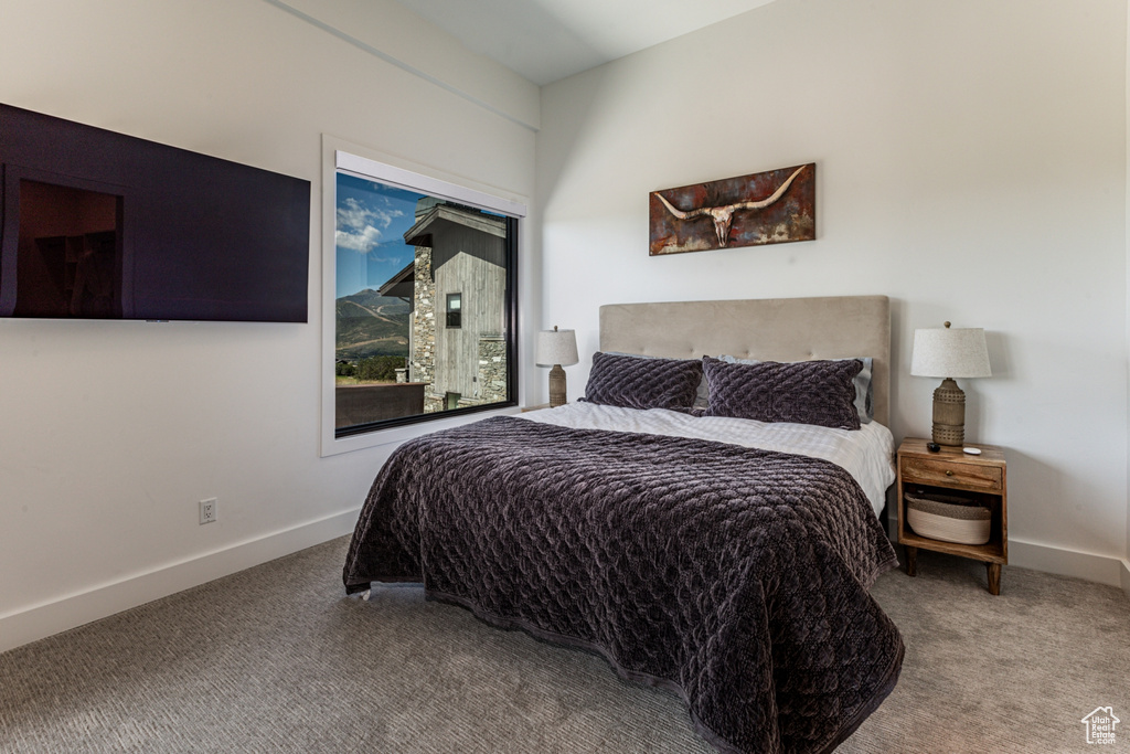 Carpeted bedroom with baseboards