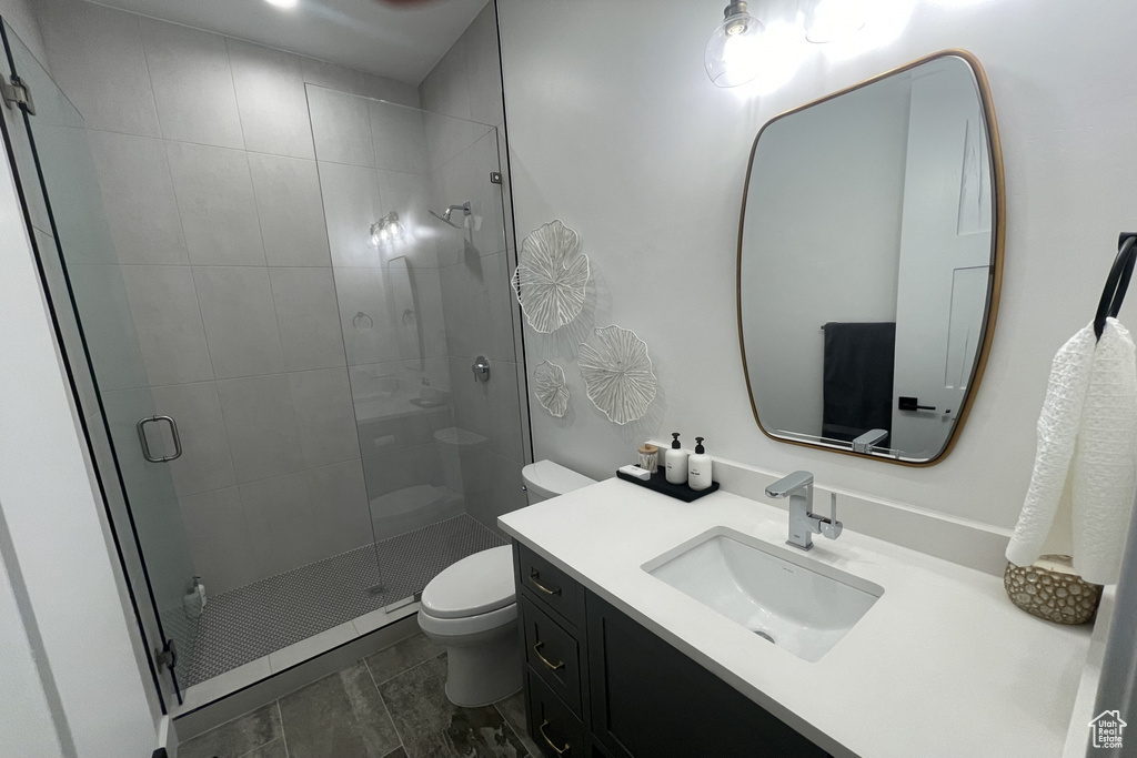 Bathroom with vanity and a shower stall