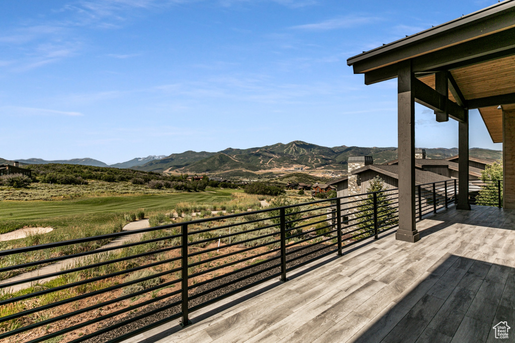 Deck featuring a patio area and a mountain view