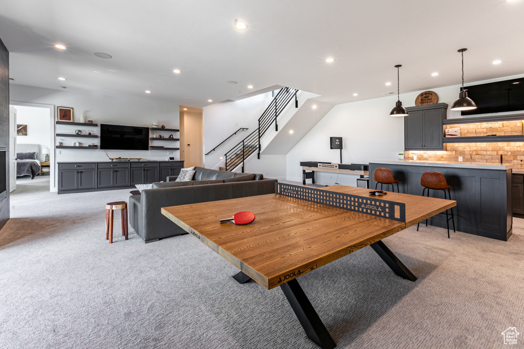 Recreation room featuring light carpet and recessed lighting
