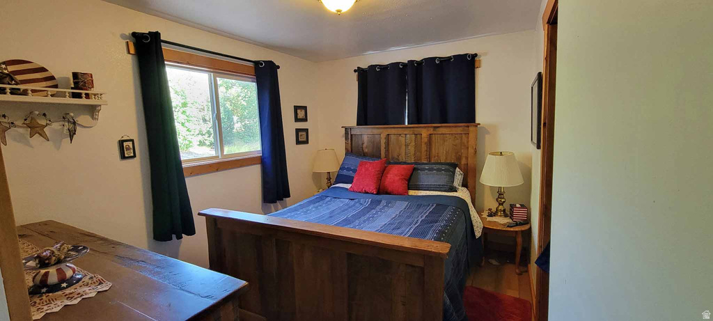 Bedroom with wood finished floors