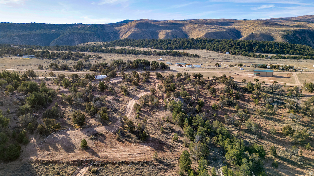 View of mountain background featuring rural landscape