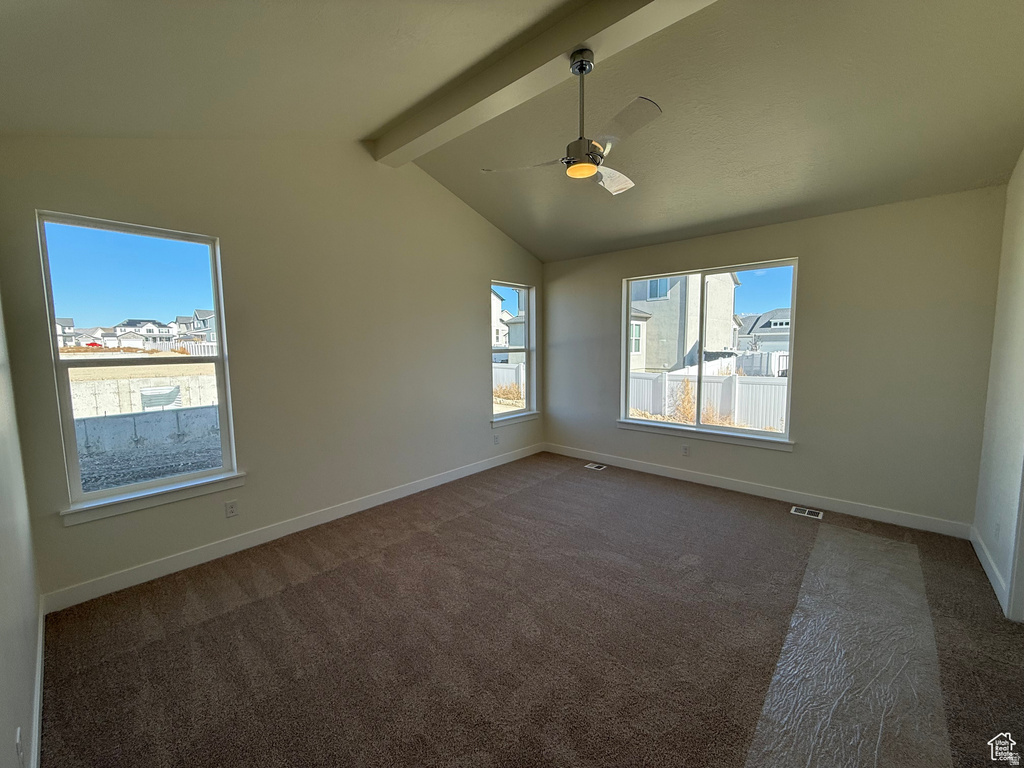 Unfurnished room with carpet and a ceiling fan