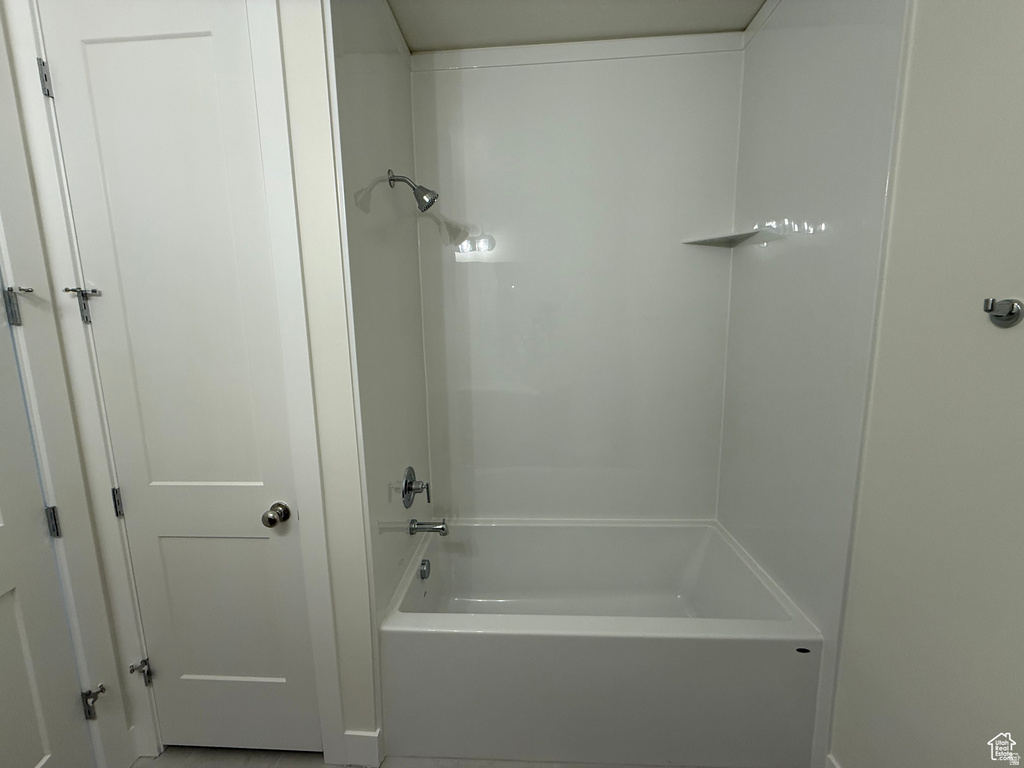 Bathroom featuring shower / washtub combination