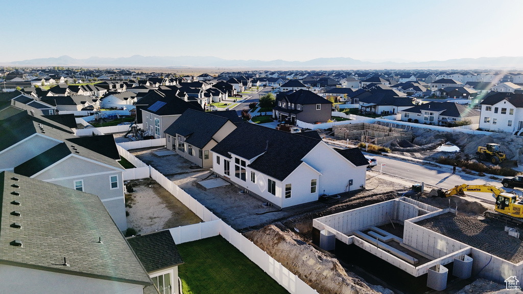 Aerial perspective of suburban area featuring a mountainous background