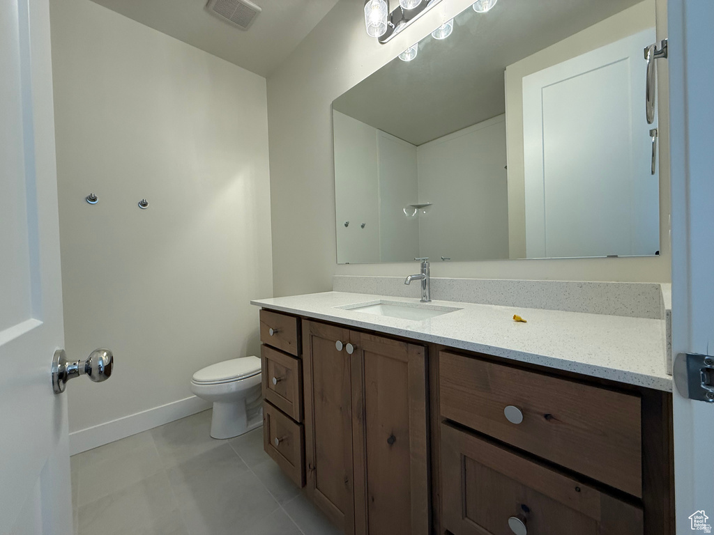 Bathroom with vanity and light tile patterned floors