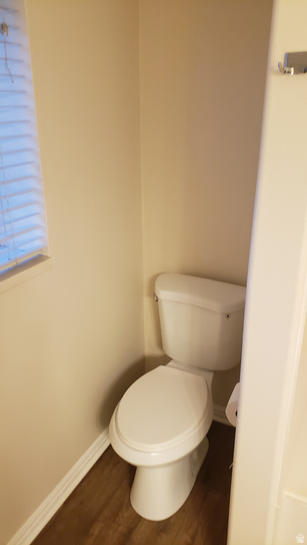 Bathroom featuring wood finished floors and baseboards