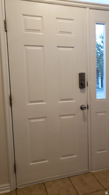 Entryway with tile patterned floors