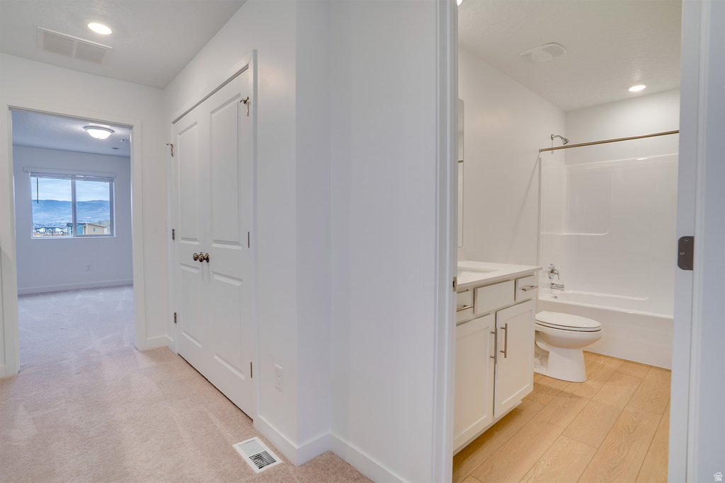 Full bathroom featuring vanity, recessed lighting, and bathtub / shower combination