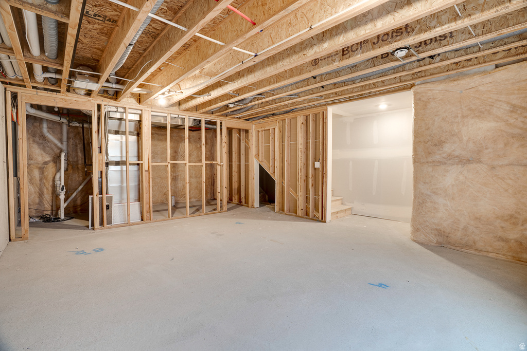 Unfinished basement featuring drainage system