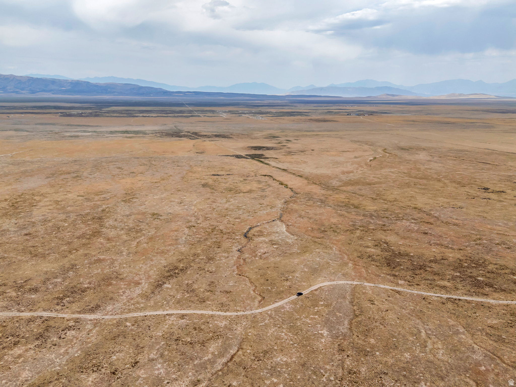 Overview of rural landscape featuring a mountainous background