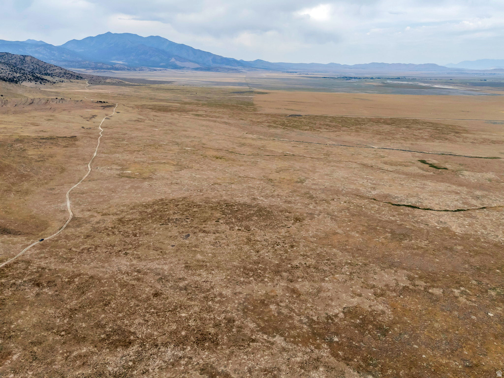 View of mountain background featuring rural landscape