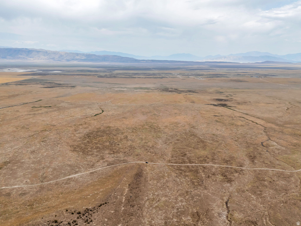 Overview of rural landscape with a mountain backdrop