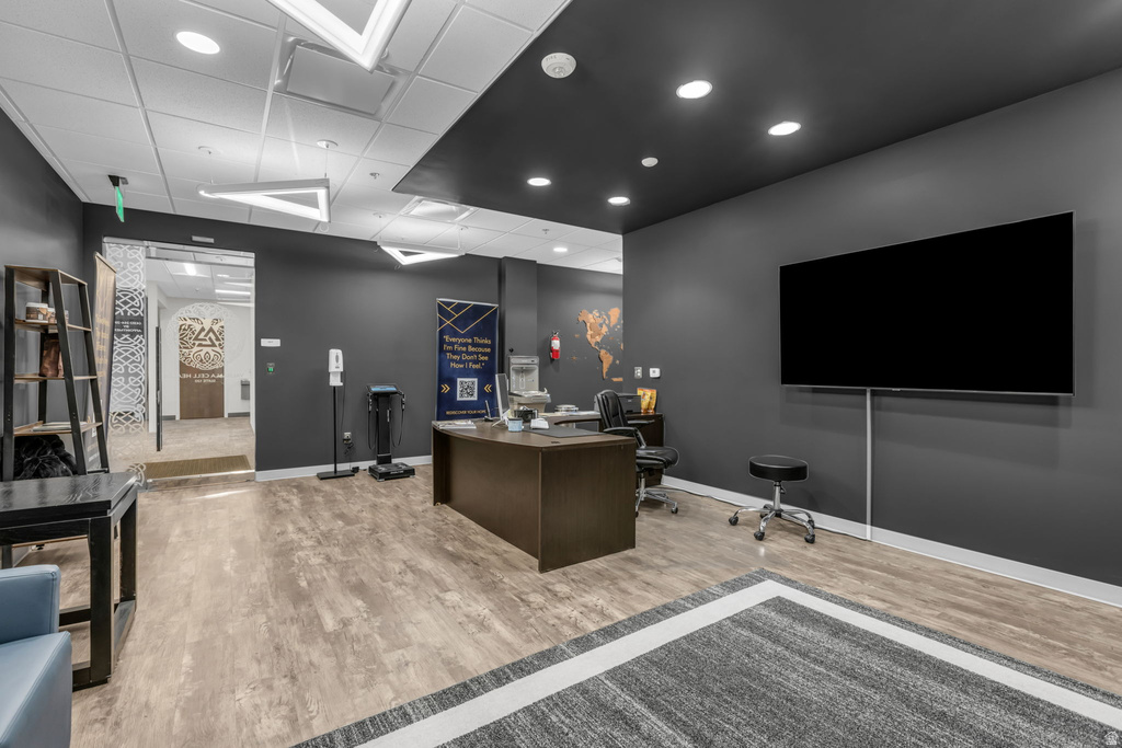 Office area with a paneled ceiling