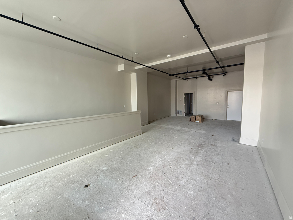 Garage featuring baseboards