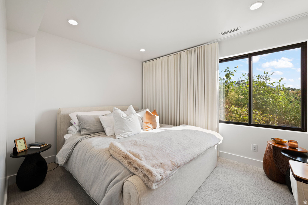 Bedroom with recessed lighting and baseboards