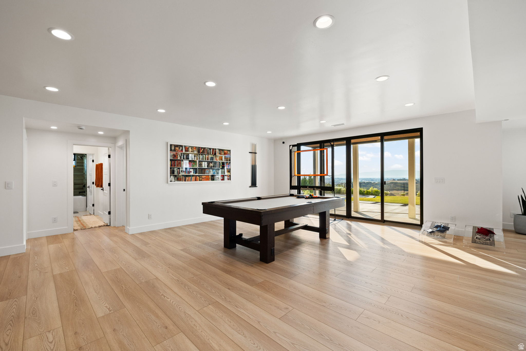Game room with billiards table, light wood finished floors, and recessed lighting