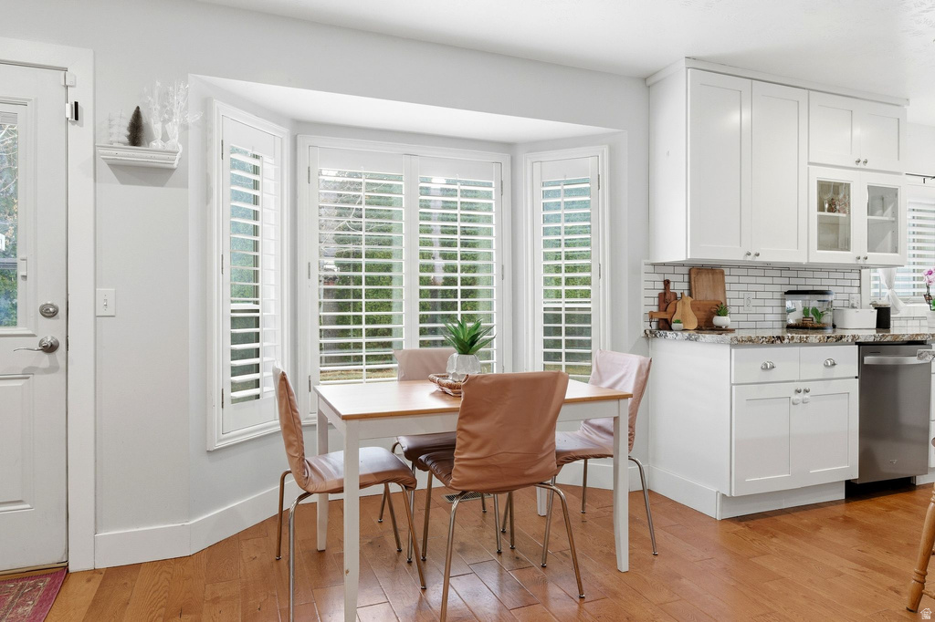 Dining room featuring light wood-style floors and baseboards