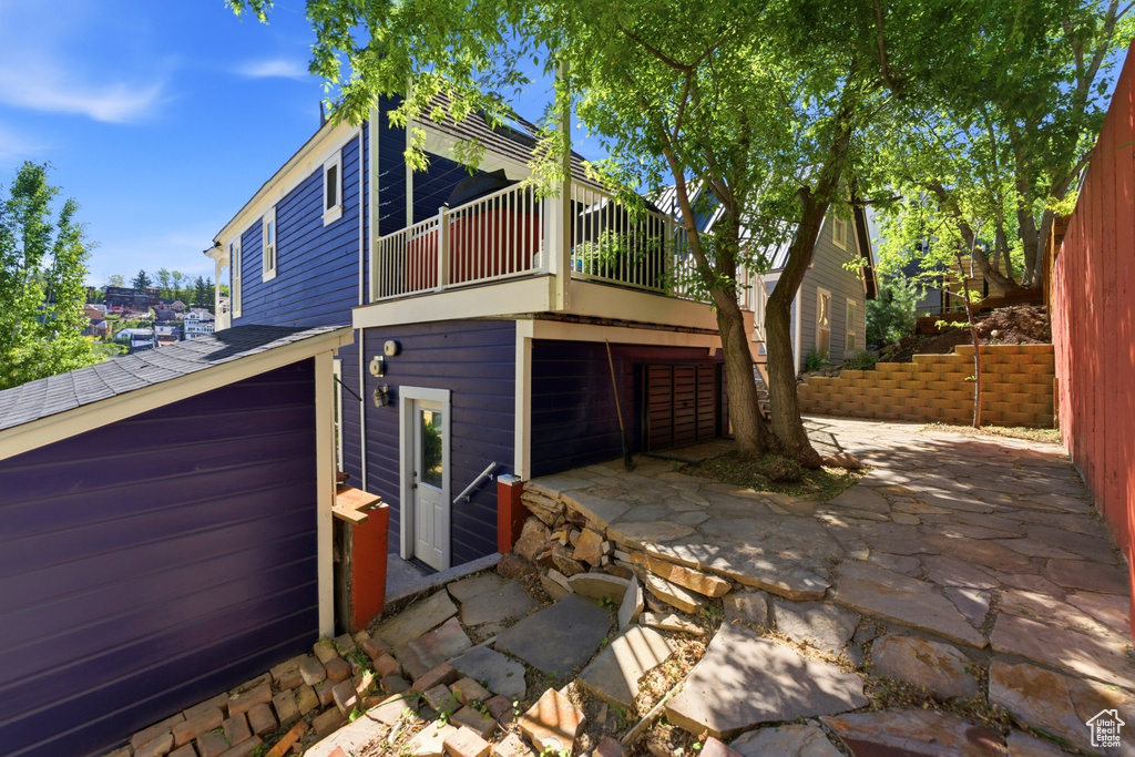 Multi-level residence featuring a vibrant blue exterior with white trim