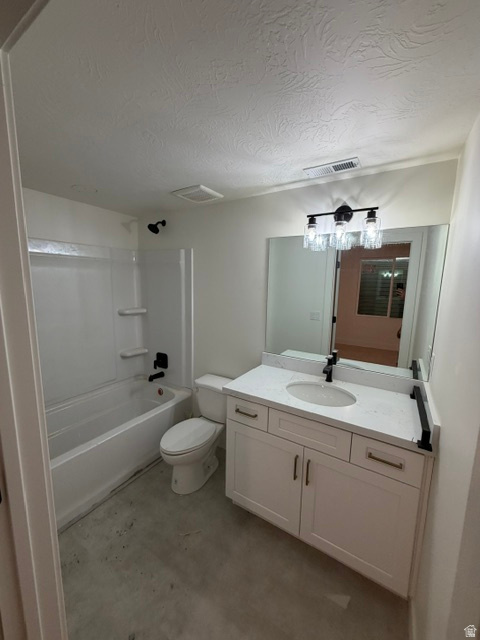 White vanity with integrated sink and quartz-finish countertop