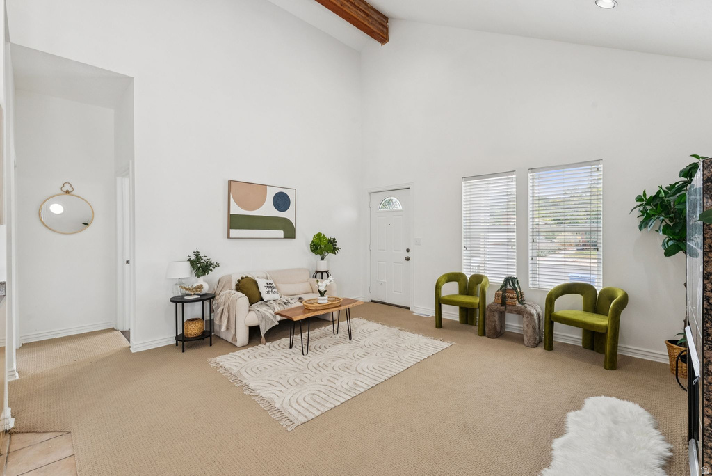 Living room featuring light carpet and vaulted ceiling