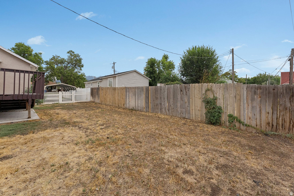 Fenced backyard with a patio
