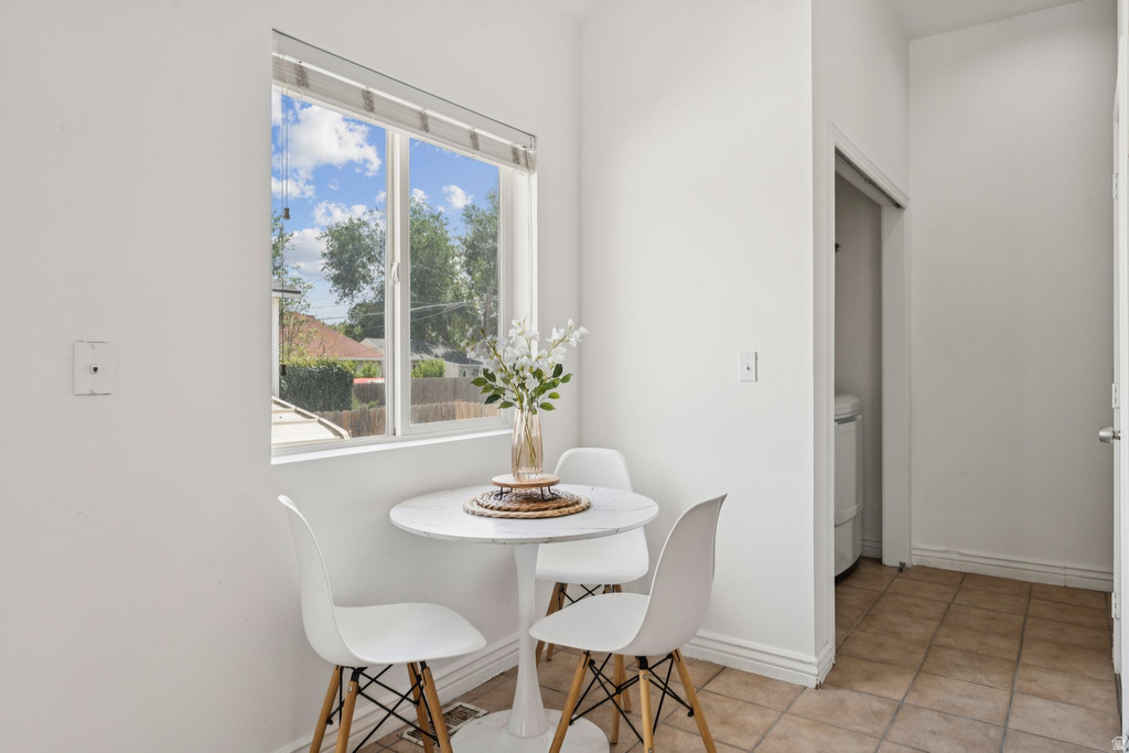 Dining area featuring baseboards and light tile patterned floors