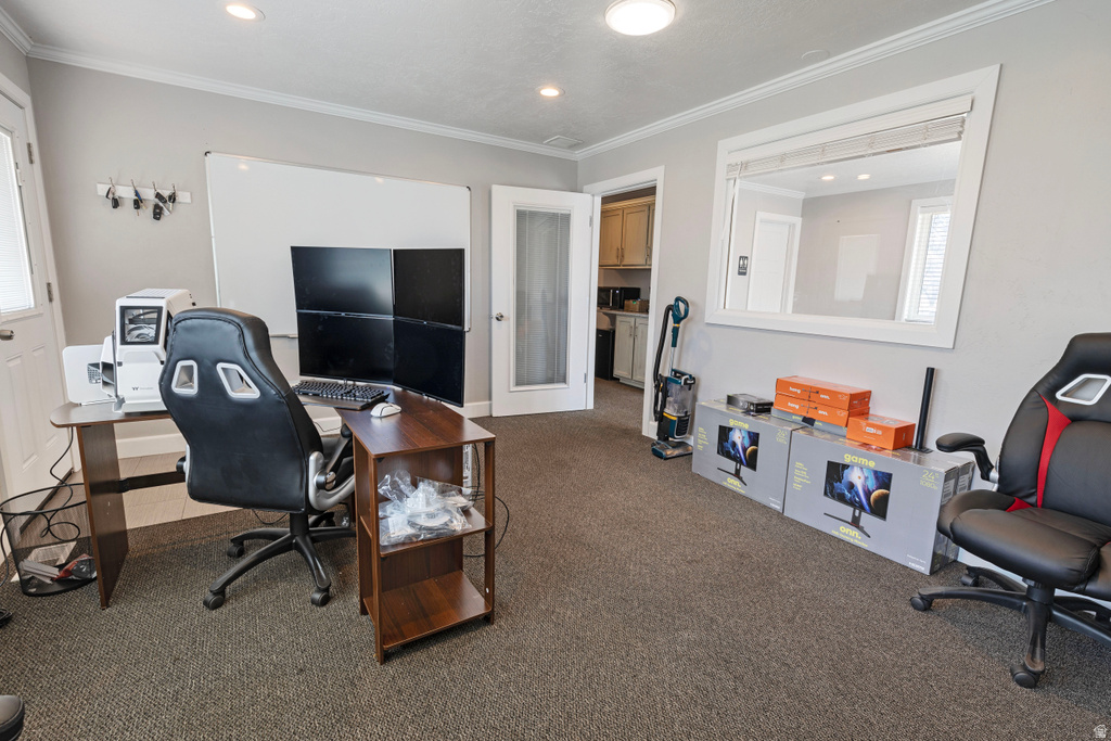 Carpeted office featuring ornamental molding and recessed lighting