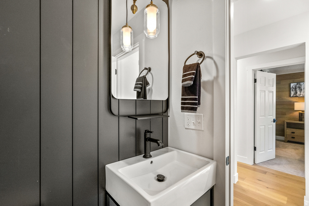 Bathroom with light wood-style floors and vanity
