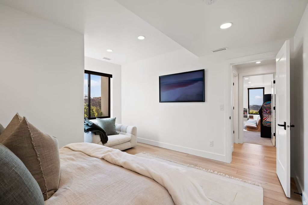 Bedroom featuring light wood-type flooring and recessed lighting
