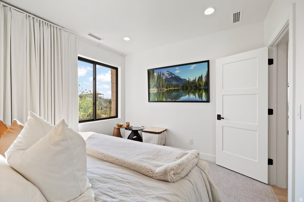 Carpeted bedroom featuring recessed lighting