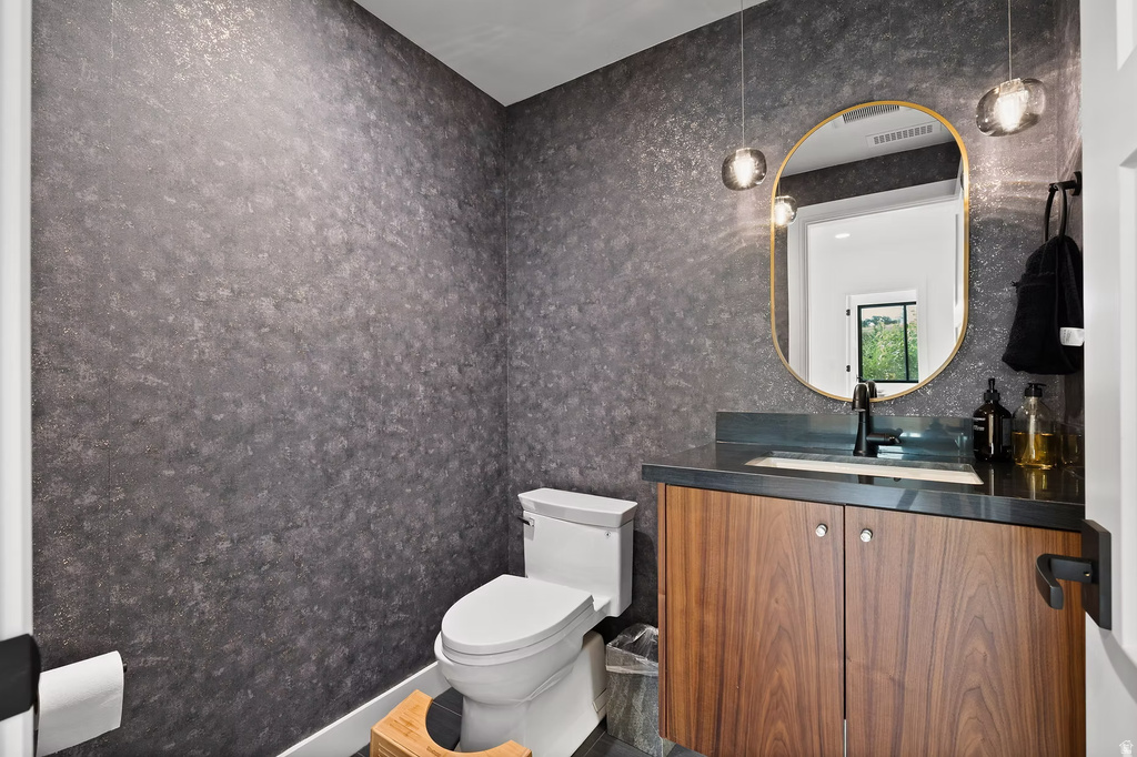 Bathroom with vanity and toilet