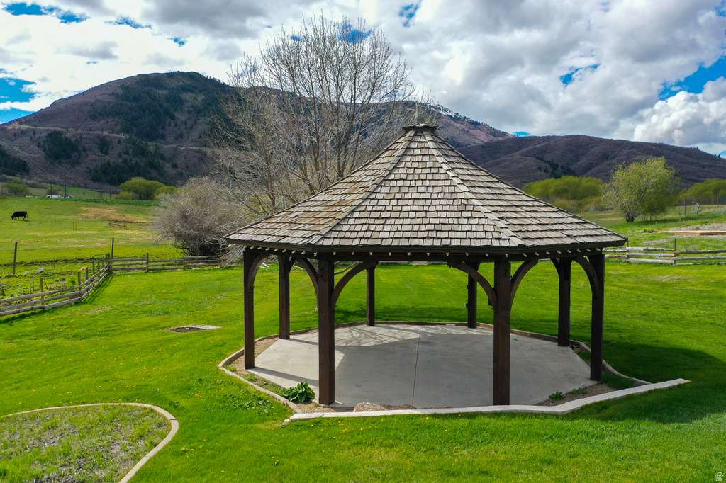 View of property\\\'s community featuring a gazebo, a patio, a mountain view, and a view of countryside